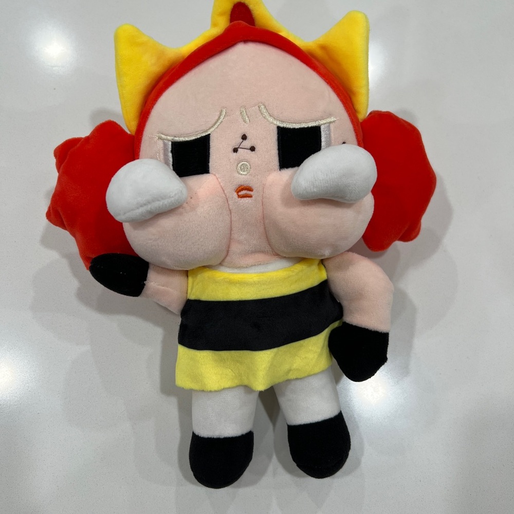 Plush Doll with Red and Yellow Accents